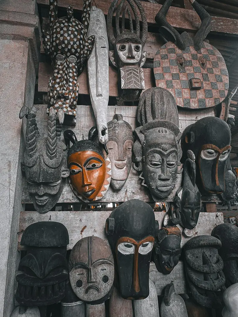 A wall of hand-carved traditional African masks